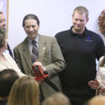 New Mexico Highlands University officials and Raton community members at the ribbon-cutting ceremony for the new Raton Learning Center in Raton, New Mexico.