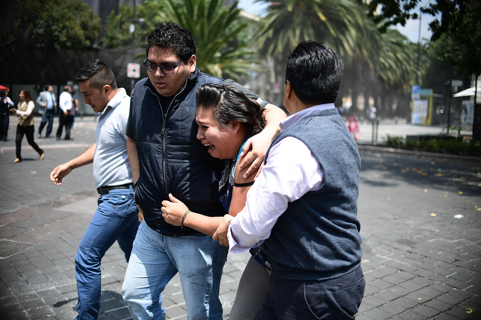 People react in the streets of Mexico City in fear and shock immediately after the earthquake struck.