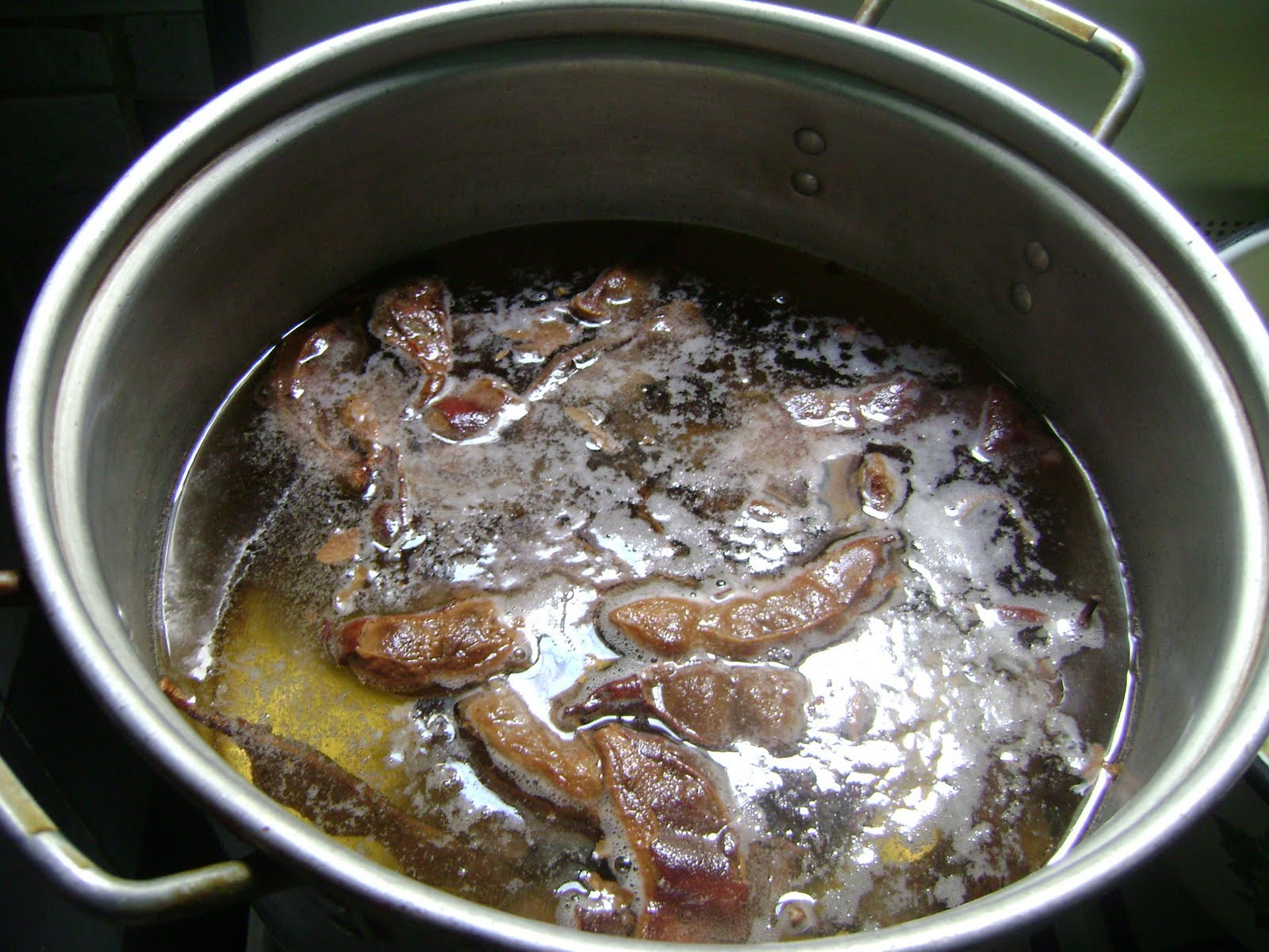 Tamarind syrup ingredients in a saucepan