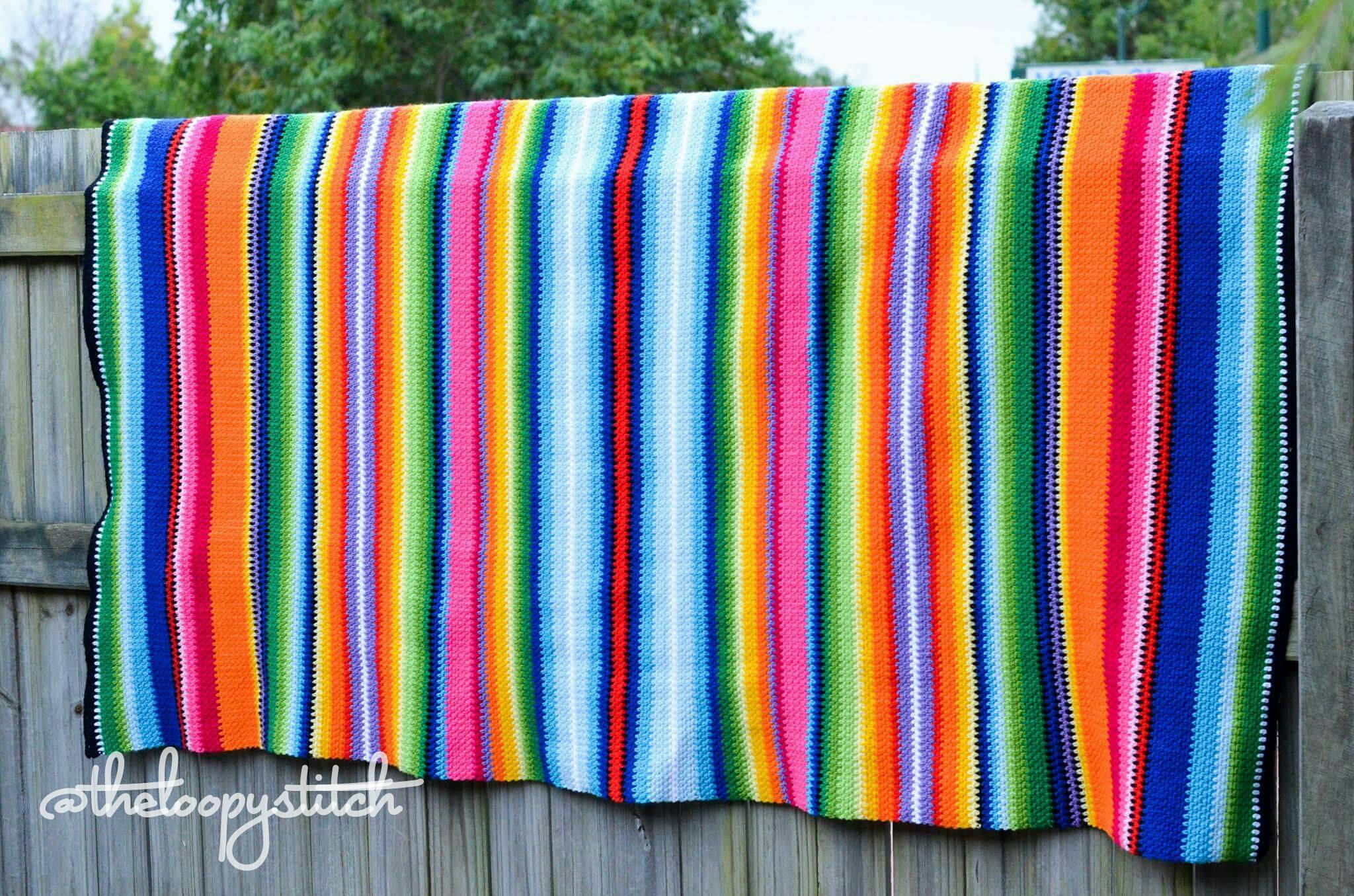 Close up detail of the crochet Mexican blanket texture and colors