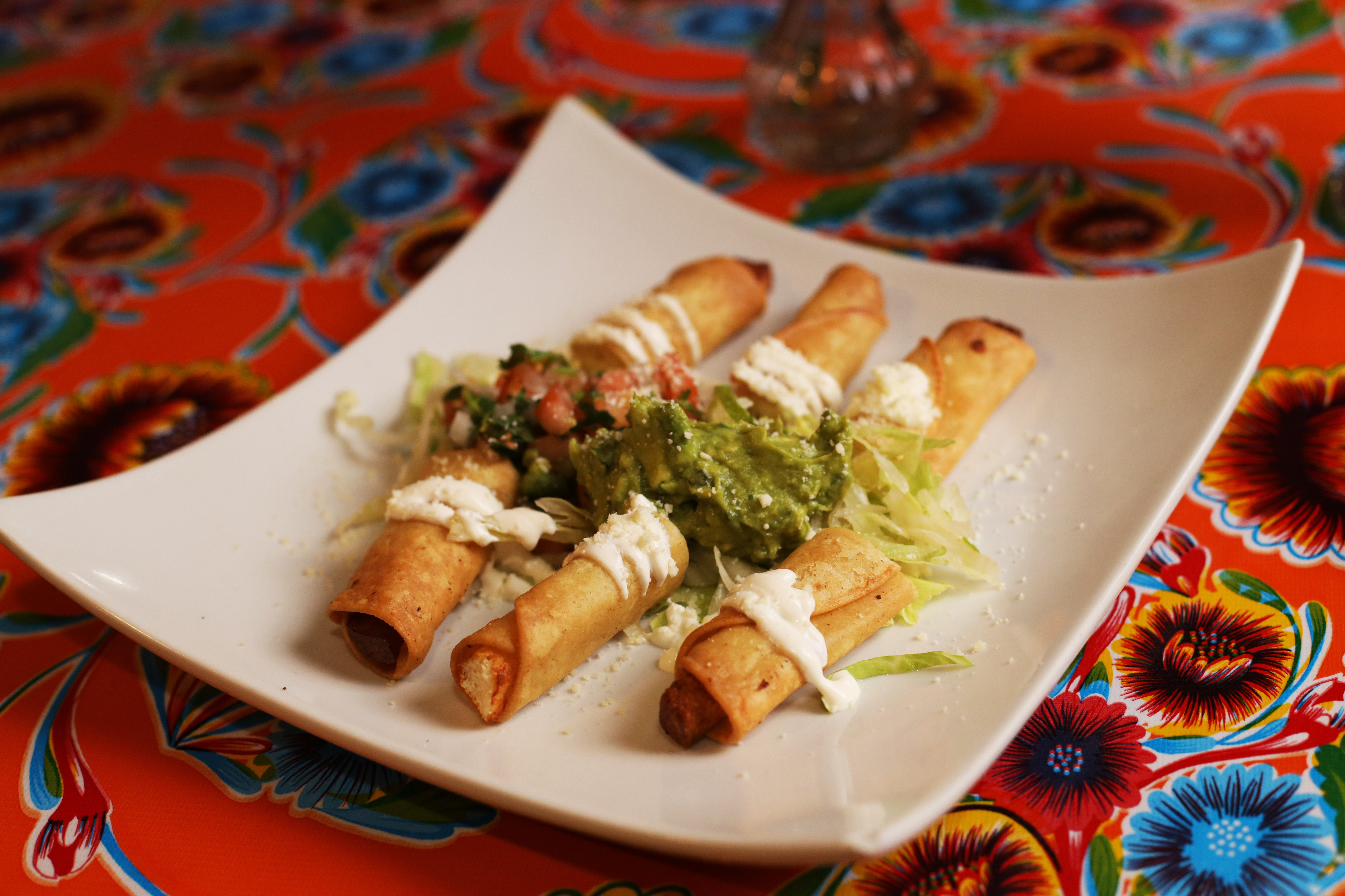 Chicken Taquitos with Sour Cream and Guacamole at La Fonda Mexican Restaurant