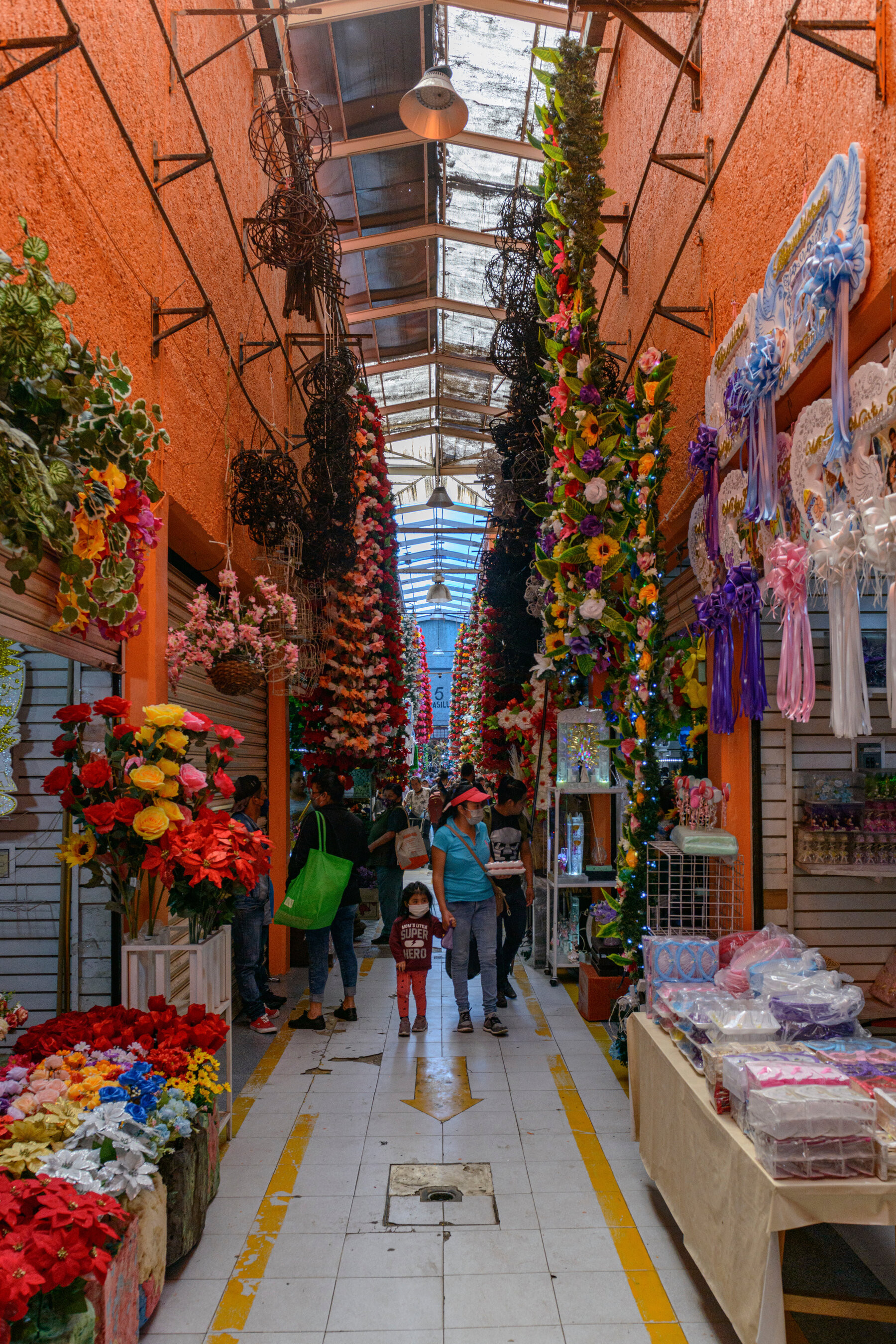 Exterior view of La Merced Market in Mexico City, showcasing bustling stalls and crowds