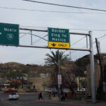 Border crossing in Nogales, Arizona, showing the fence and urban landscape