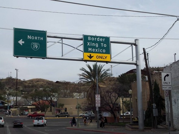 Border crossing in Nogales, Arizona, showing the fence and urban landscape