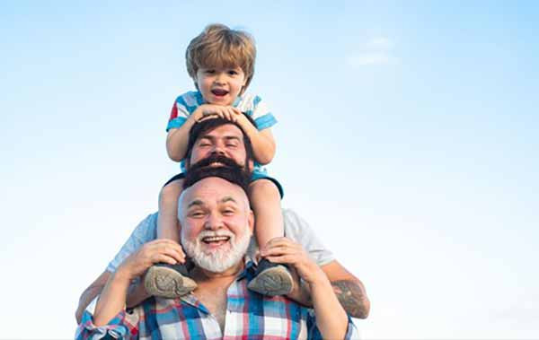 Two fathers and a child celebrating Father's Day