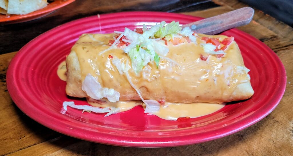 Chimichanga with cheese sauce at Blue Agave