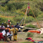 Photos of the missing surfers placed on the beach in Ensenada, Mexico