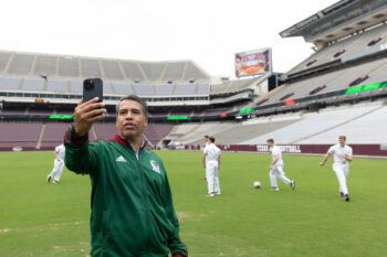 Mexican soccer legend Pavel Pardo takes a selfie with Texas A&amp;M Yell Leaders on Kyle Field during a promotional event for the upcoming Brazil vs Mexico game