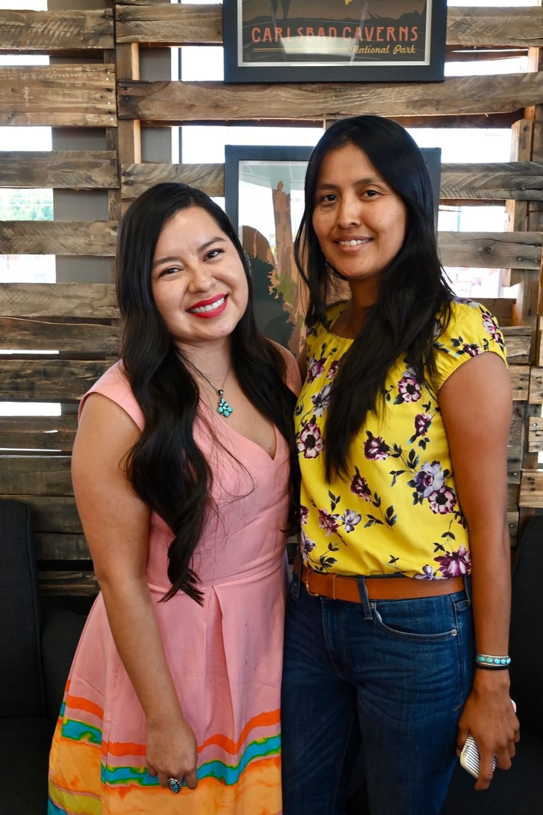 Close up shot of smiling faces at the Fancy Navajo coffee meetup, highlighting the positive energy.