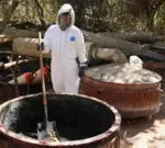 Mexican army personnel in protective suits inspect a meth lab in Higueras de Abuya, Sinaloa.