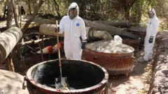 Mexican army personnel in protective suits inspect a meth lab in Higueras de Abuya, Sinaloa.