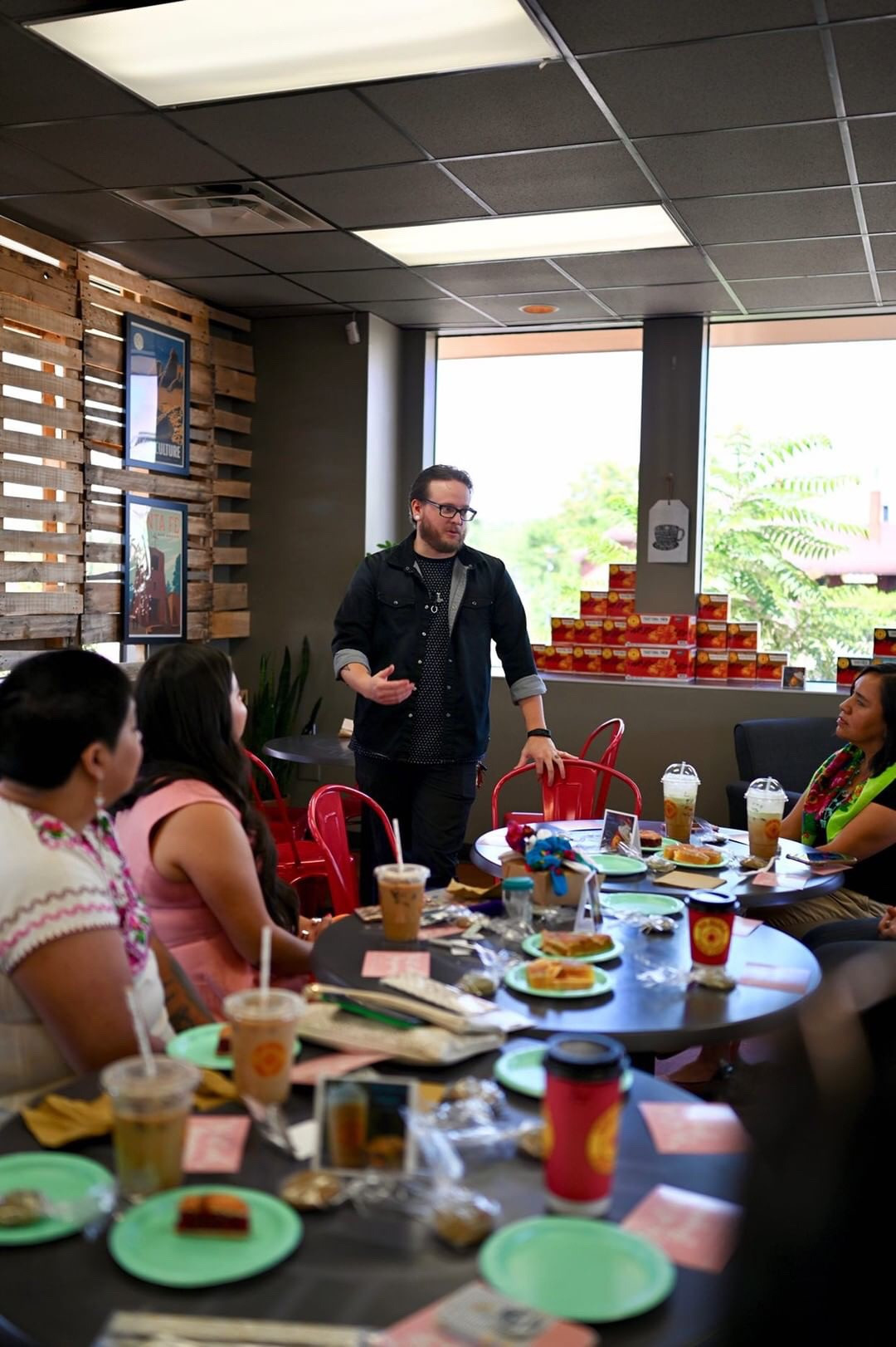 Attendees listening attentively while learning about the nuances of coffee.