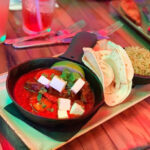 A colorful exterior of Antojitos restaurant at City Walk Orlando.