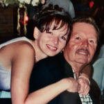 Armando Galan and his daughter Linda Galan-Ramirez smiling warmly at each other, showcasing a close family bond and the legacy of Armando's Mexican Cuisine in Detroit.