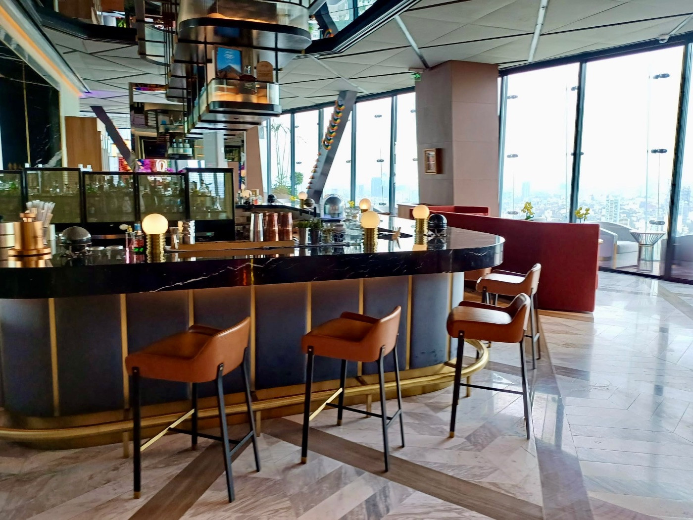 Samos bar at The Ritz-Carlton Mexico City, showcasing the stylish interior and panoramic city views.