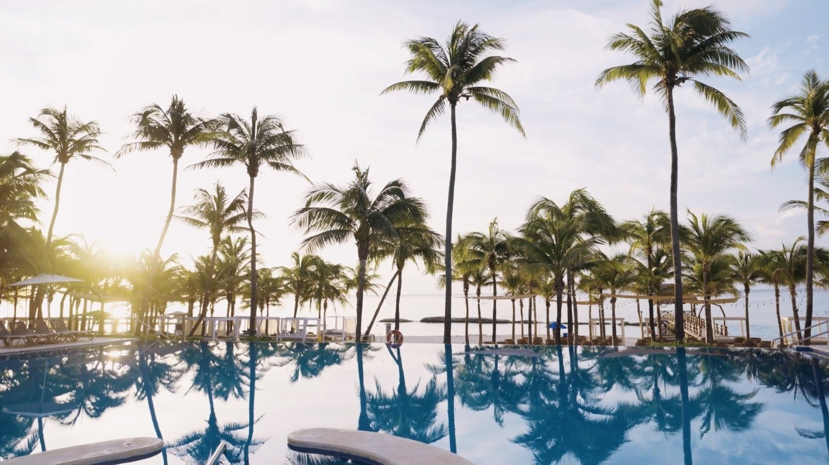 alt= Aerial view of The Fives Oceanfront Puerto Morelos showcasing its pristine beach and tranquil surroundings.