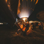 Attendees taking photos of the mass ascension at the Albuquerque Hot Air Balloon Festival