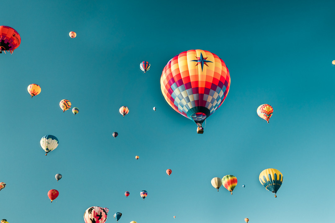 Hot air balloons beginning to inflate for the mass ascension at the Albuquerque International Balloon Fiesta