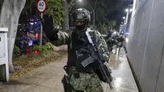 A Mexican soldier in Sinaloa, a state grappling with increased violence due to cartel conflicts.