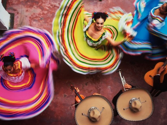 Folkloric dancers in vibrant costumes
