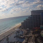 Live Cancun beach webcam view showcasing clear skies and turquoise waters