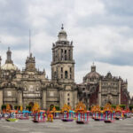 Mexico City Metropolitan Cathedral showcasing a blend of architectural styles and Day of the Dead decorations in the Zocalo
