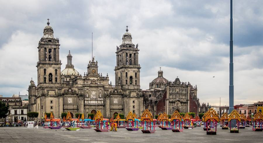 Mexico City Metropolitan Cathedral showcasing a blend of architectural styles and Day of the Dead decorations in the Zocalo