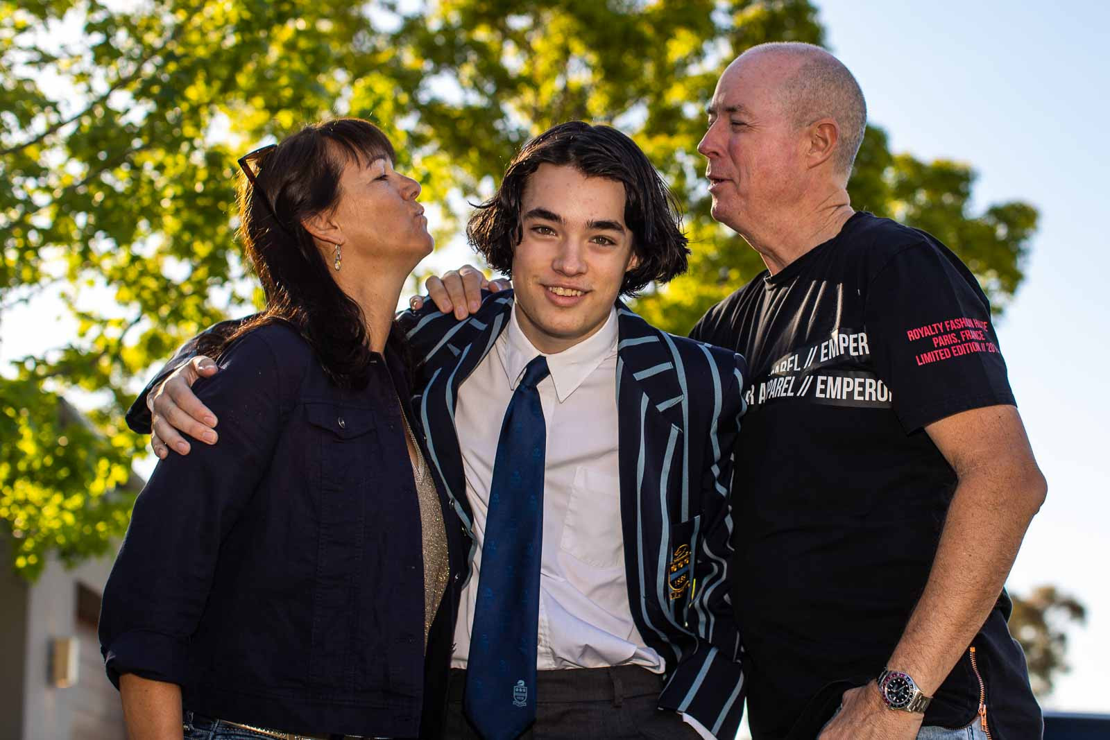 Photographer Kym Illman with his wife Tonya and son Jayce on Jayce's high school graduation day