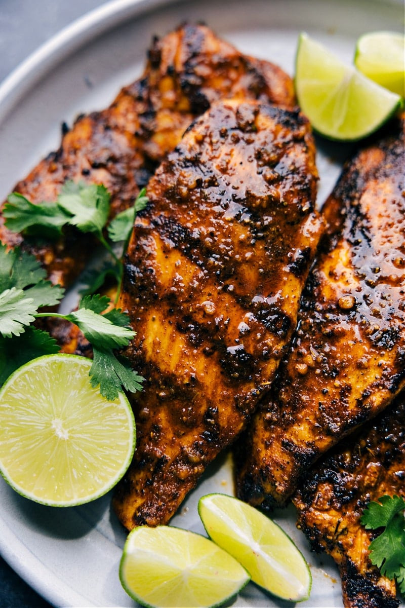 Image of marinated chicken in a bowl, ready for grilling, showcasing the vibrant colors of the marinade