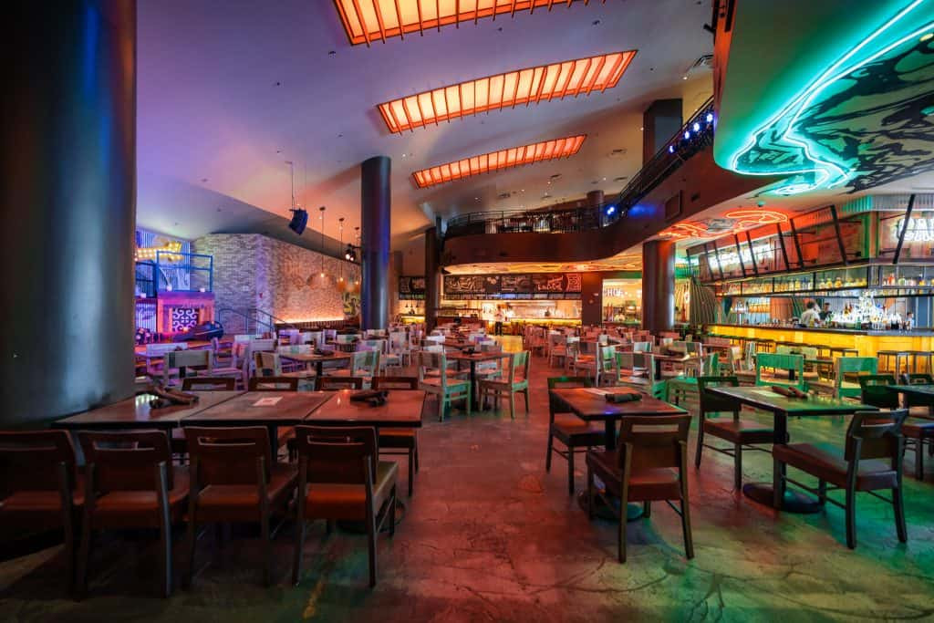 Vibrant interior of Antojitos Authentic Mexican Food at Universal CityWalk showcasing colorful decor and bird-cage booths