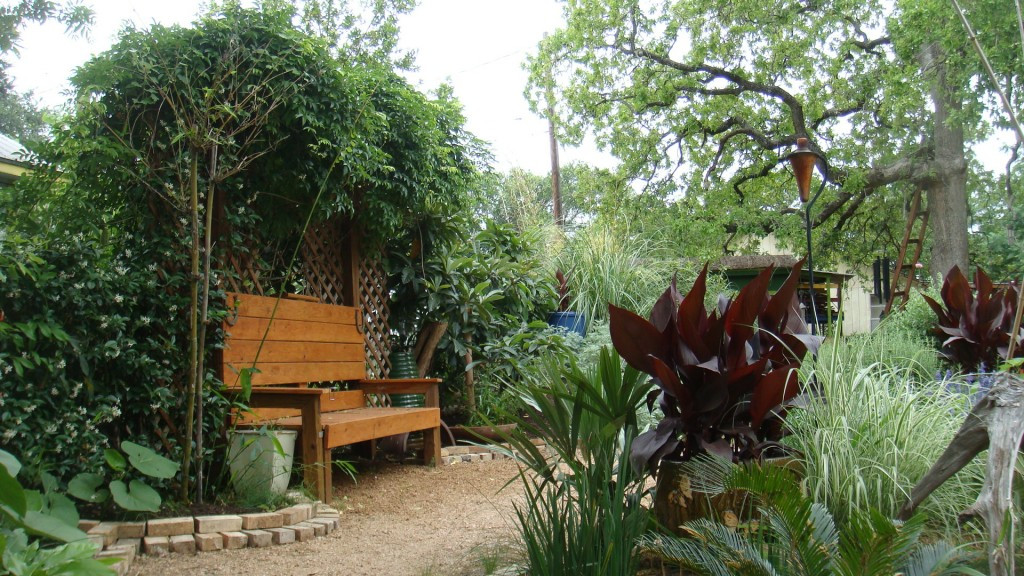 alt: A newly constructed brick border around a garden bench.