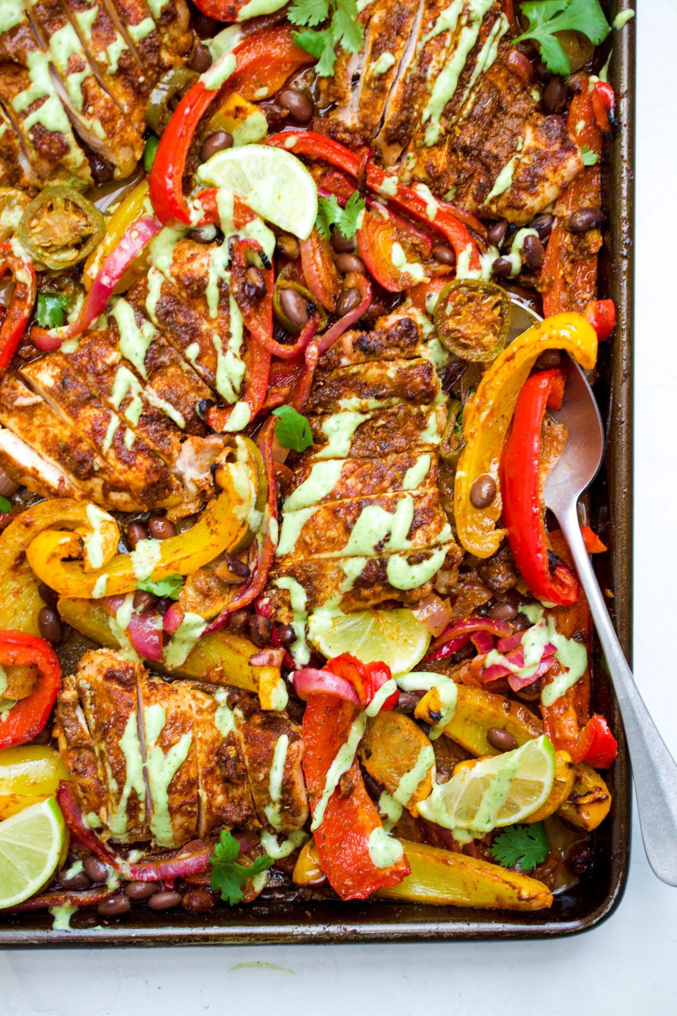 Overhead shot of Sheet Pan Mexican Chicken and Veggies with cilantro garnish