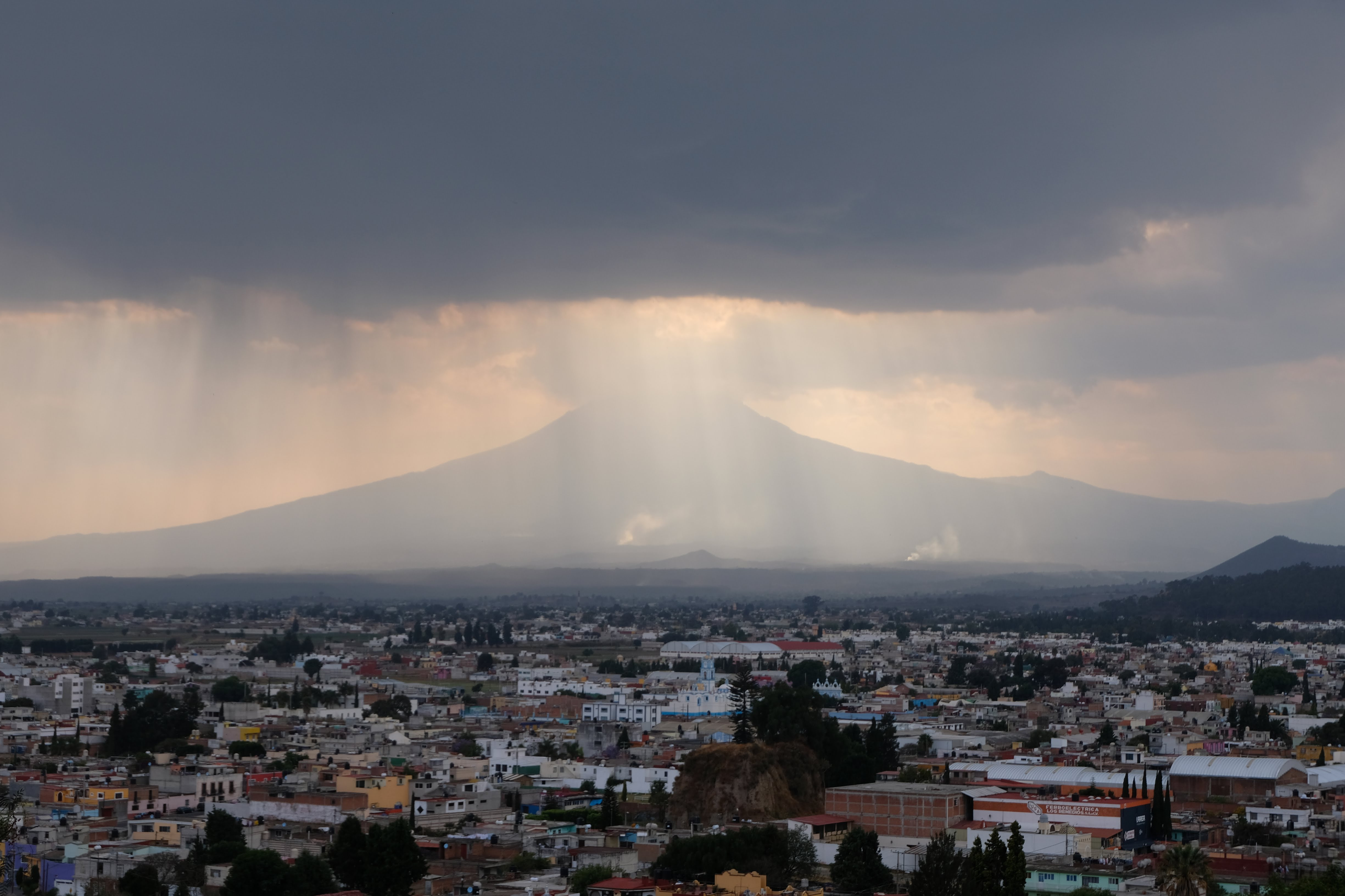 View over the stormy volcanoes from the church