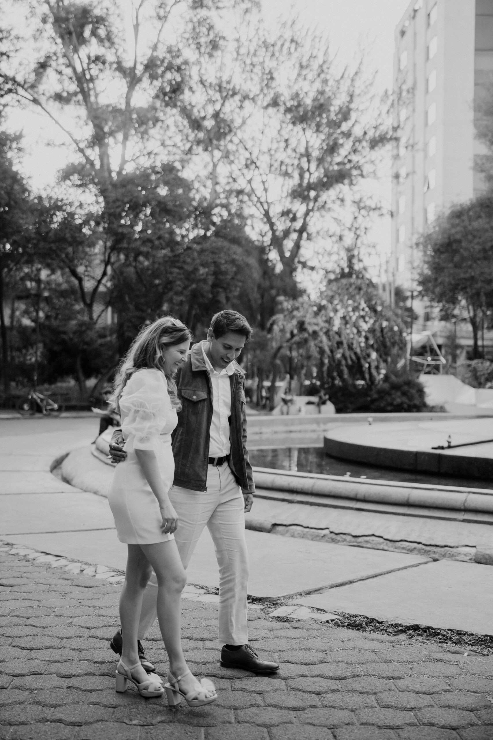 Plaza Rio de Janiero mexico pictures: A couple walks together in the beautiful Plaza Rio de Janiero, capturing the essence of a Mexico City engagement