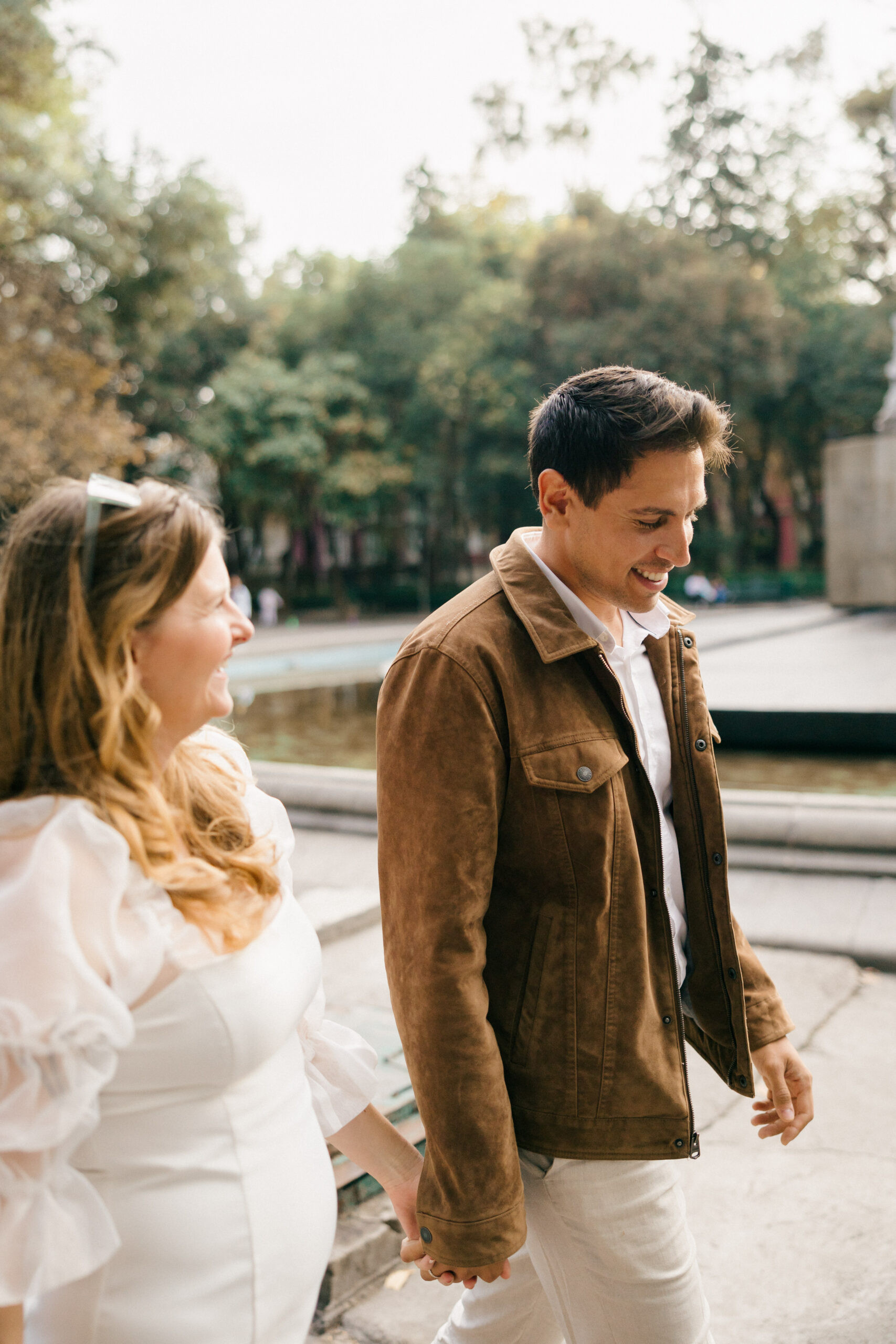 Walking in Mexico City pictures: A beautiful couple strolls through the charming streets of Mexico City, capturing candid moments during their photoshoot