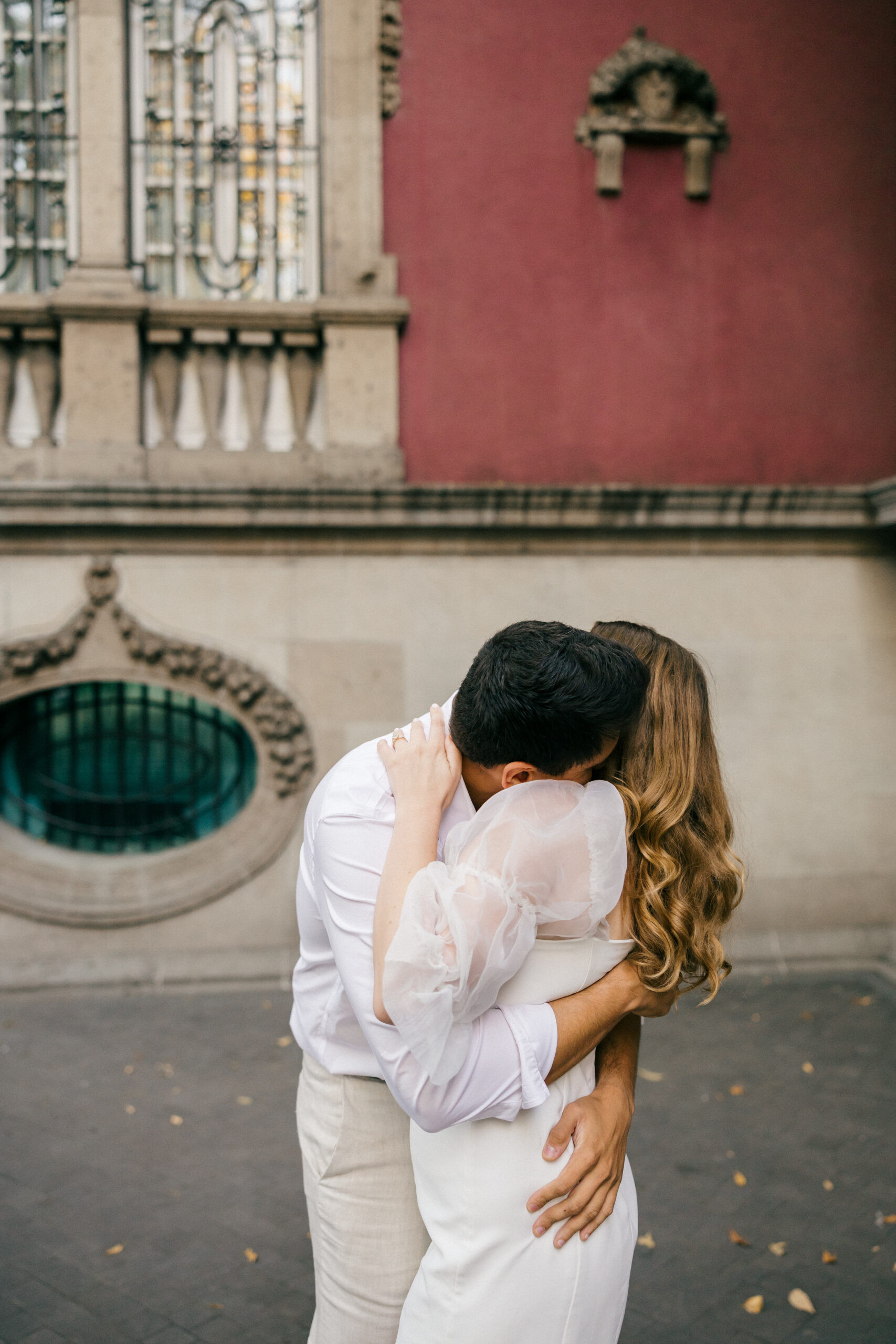 Romantic moment mexico pictures: A beautiful couple shares a sweet kiss amidst the captivating scenery of Mexico City