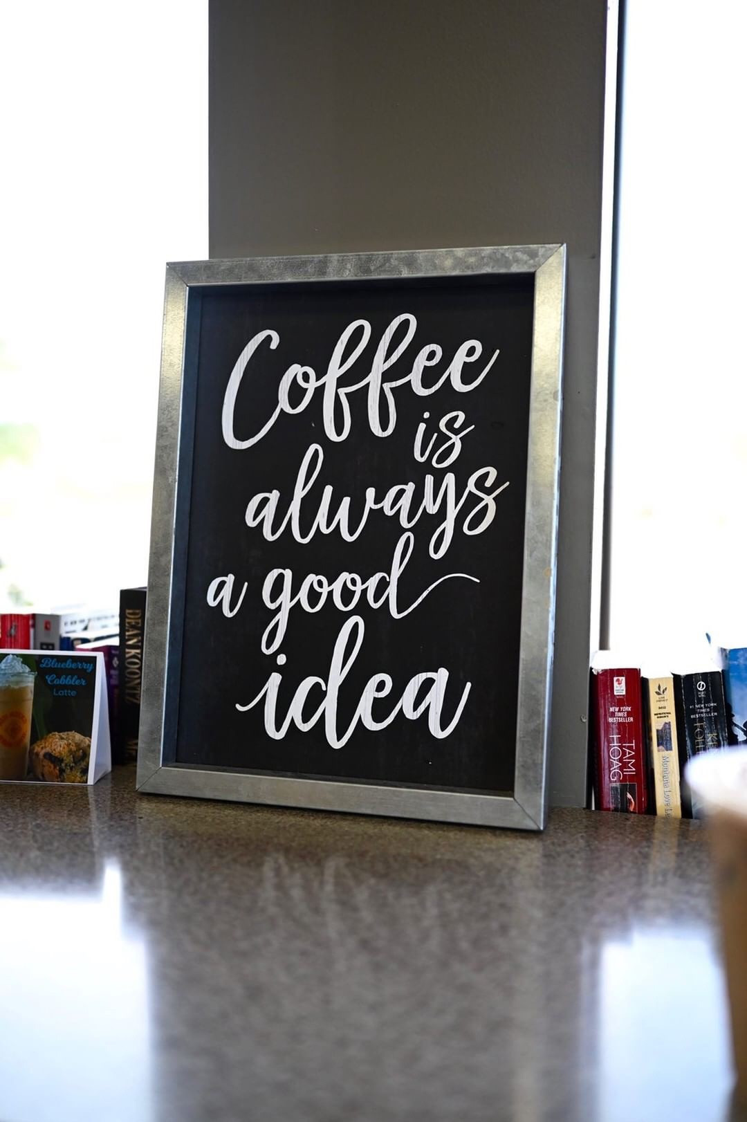 Enthusiastic sign declaring &quot;I couldn't agree more!&quot;, highlighting the positive atmosphere of Piñon Coffee House.