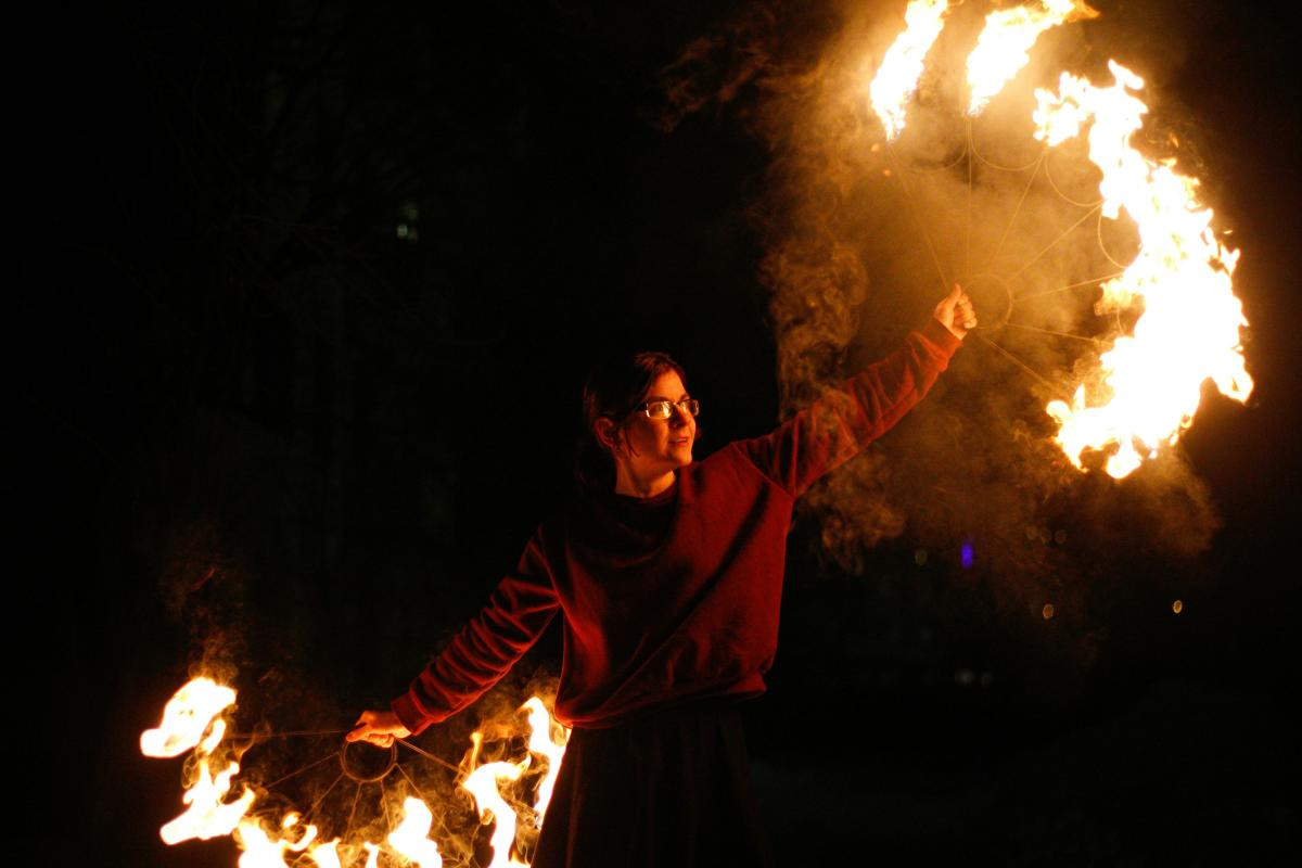 Toca Madera restaurant interior with fire dancer performance and stylish decor