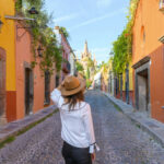 Woman admiring the parish church in San Miguel de Allende, Mexico