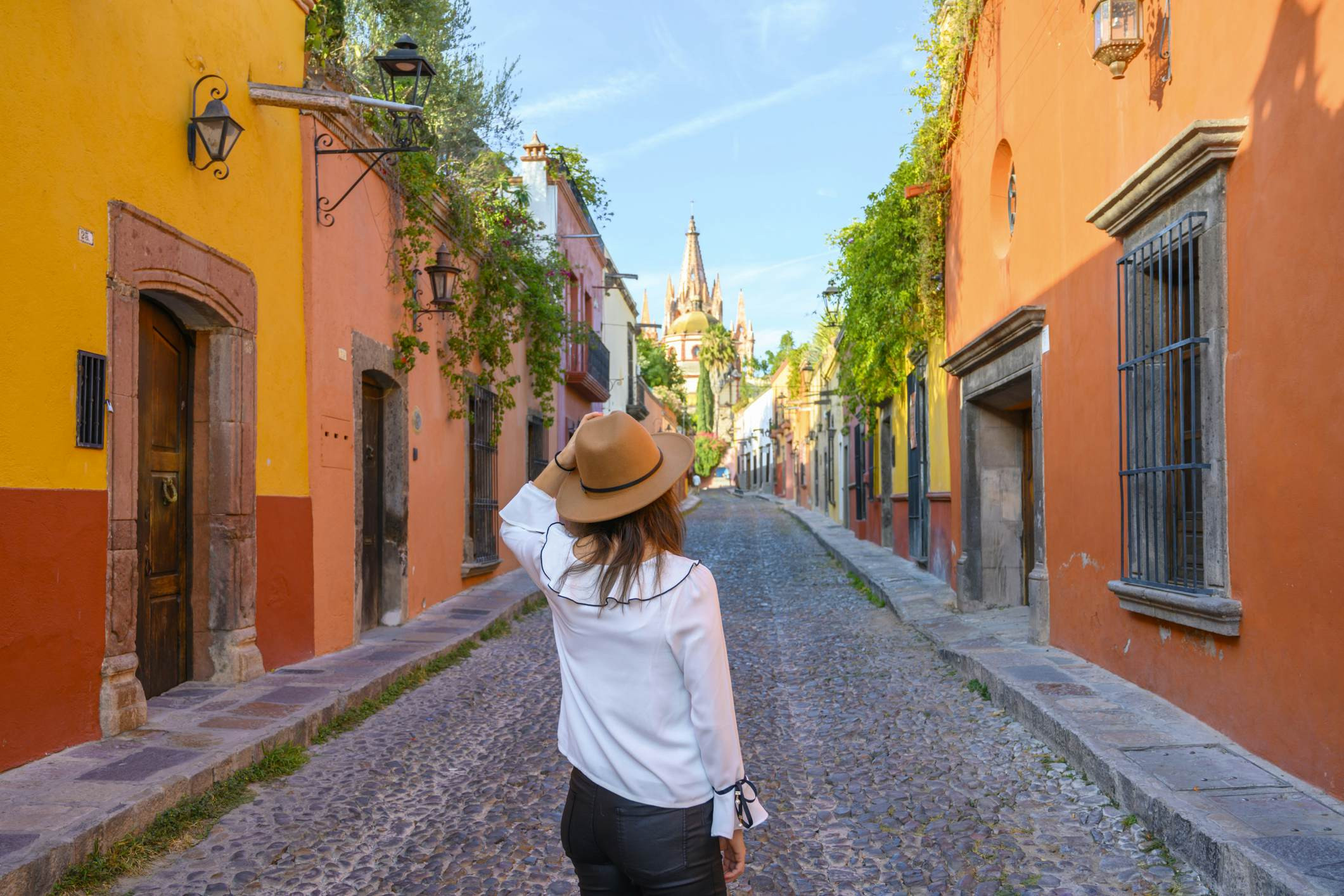 Woman admiring the parish church in San Miguel de Allende, Mexico