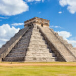 Majestic Mayan Ruins of Chichen Itza in Mexico, featuring the iconic Temple of Kukulcan pyramid, a testament to ancient Mesoamerican architecture.