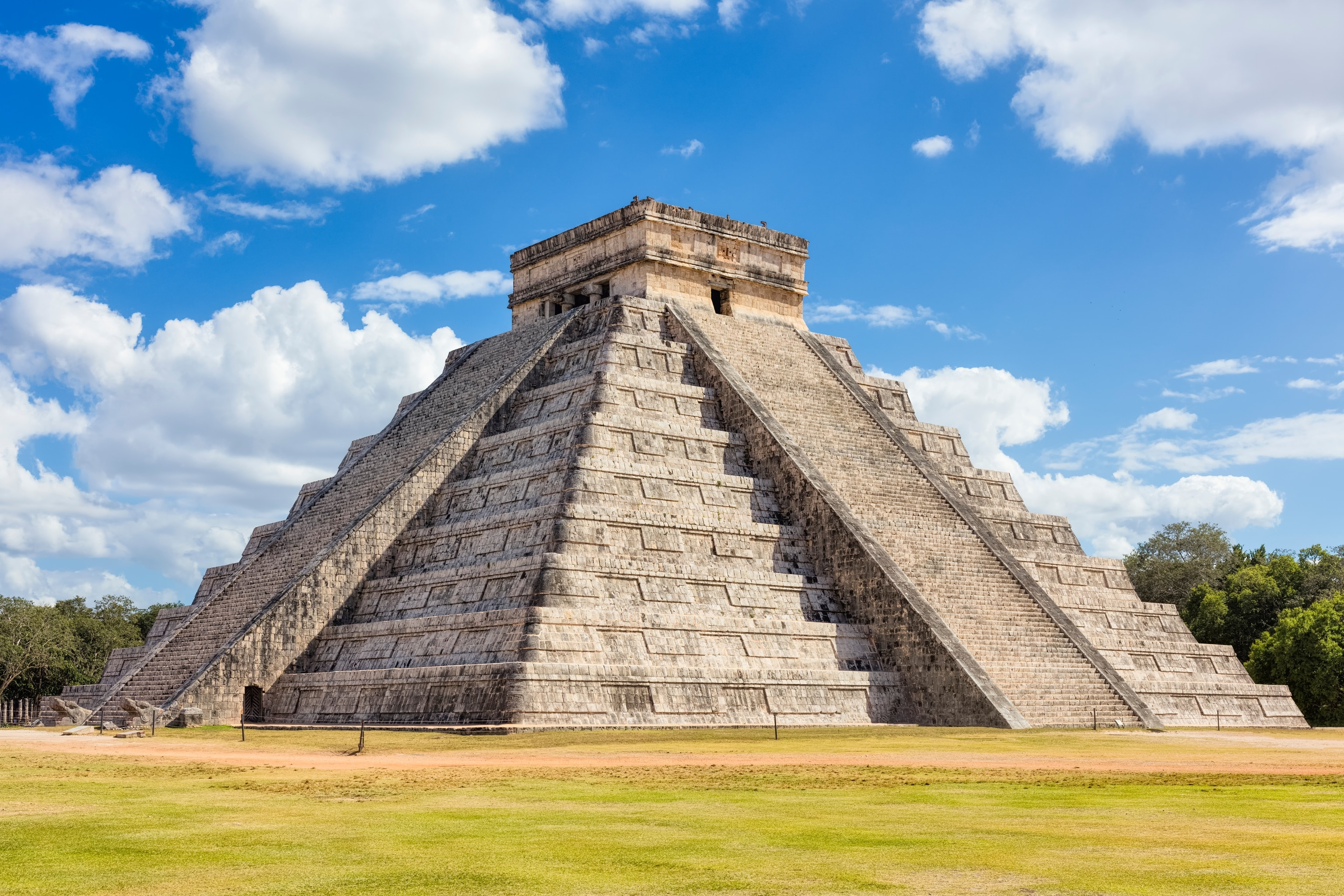 Majestic Mayan Ruins of Chichen Itza in Mexico, featuring the iconic Temple of Kukulcan pyramid, a testament to ancient Mesoamerican architecture.