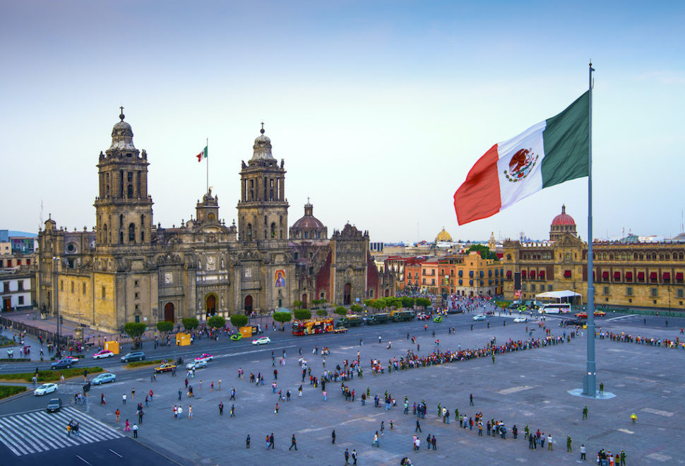 A bustling square in Mexico City, Mexico, highlighting the city's blend of historical and modern elements and its reputation for safety improvements