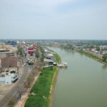 The Grijalva River flowing through Villahermosa, Tabasco, Mexico, showcasing the state's significant river systems and waterways used for transportation and fertile lands.