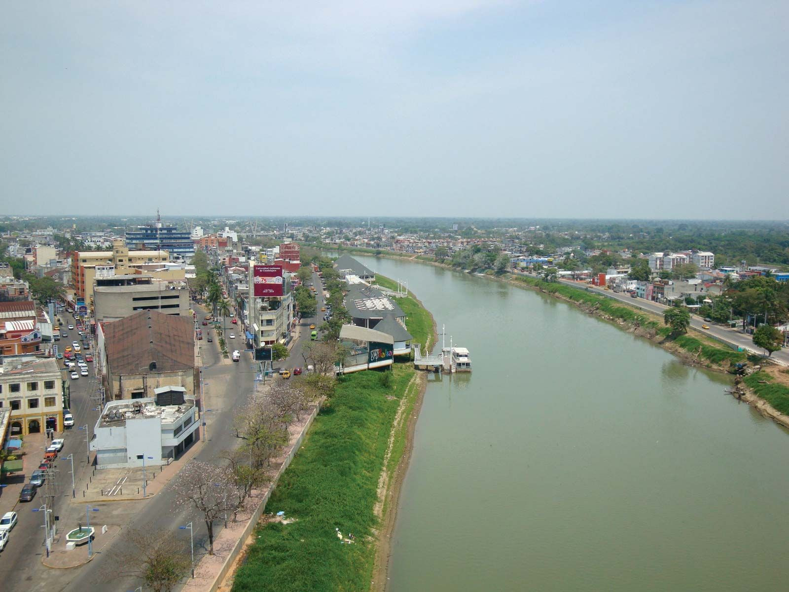 The Grijalva River flowing through Villahermosa, Tabasco, Mexico, showcasing the state's significant river systems and waterways used for transportation and fertile lands.