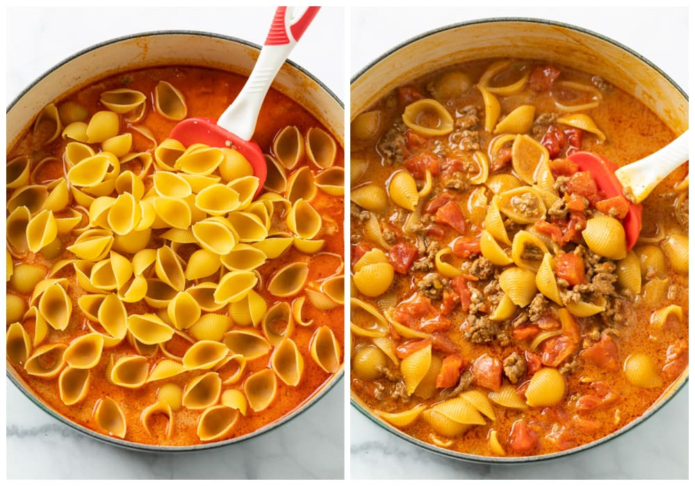 Pasta shells being added to the taco sauce in a pot, showing how to combine ingredients for Mexican Pasta.