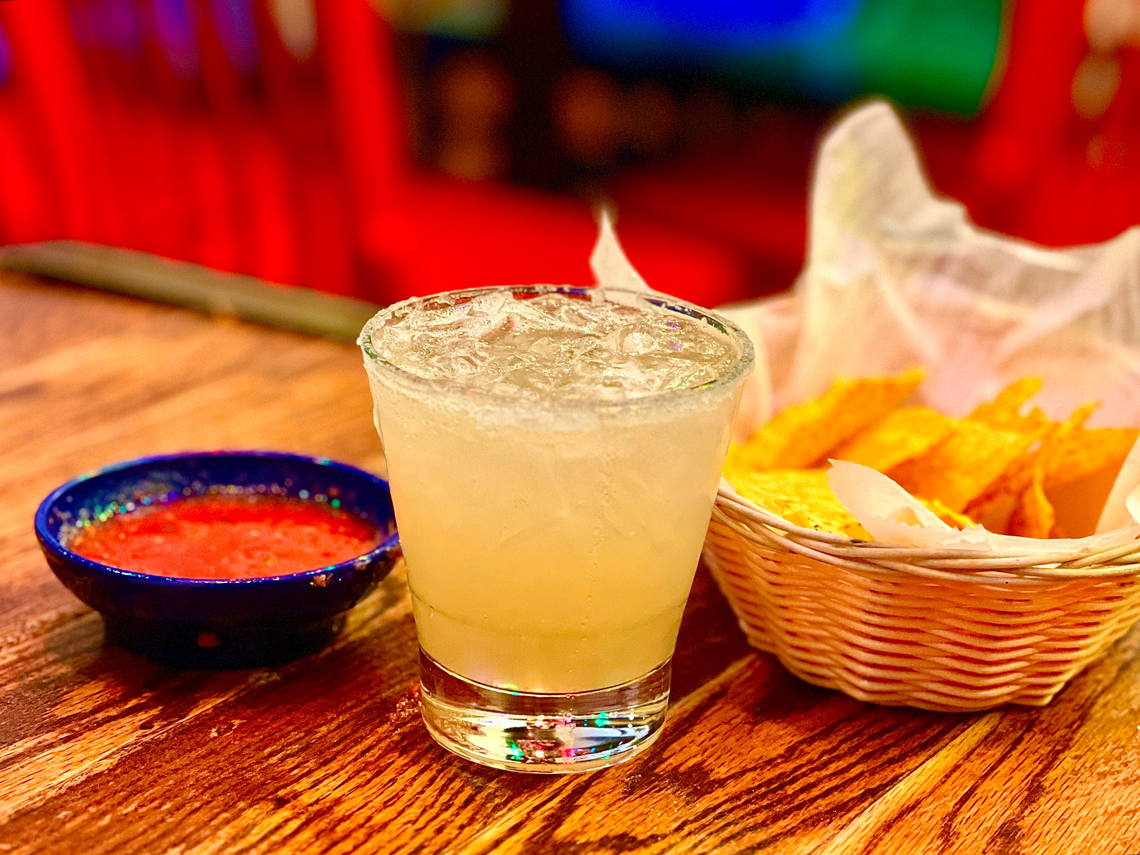 alt text: A margarita in a salt-rimmed glass, sitting on a table at Su Casa Mexican Restaurant.