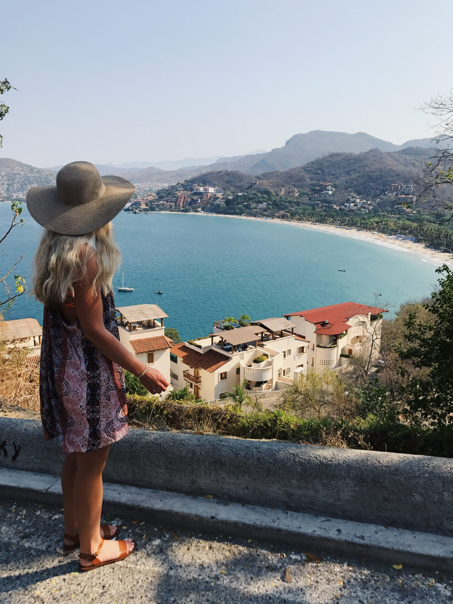 Walking along the sandy beach of Zihuatanejo, Mexico