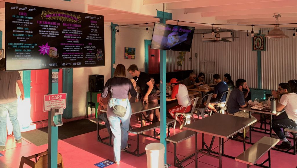 The vibrant pink floor and colorful decor at Rollies Mexican Patio