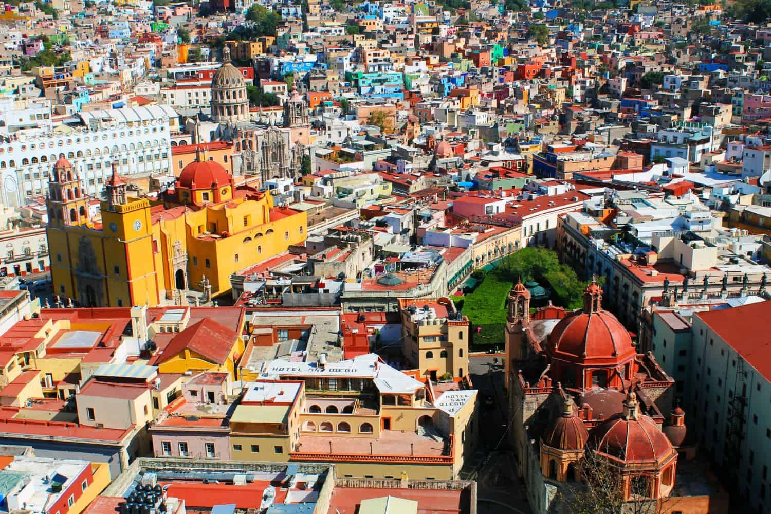 A close-up view of the colorful buildings in Guanajuato, Mexico, highlighting the architectural details and vibrant colors.